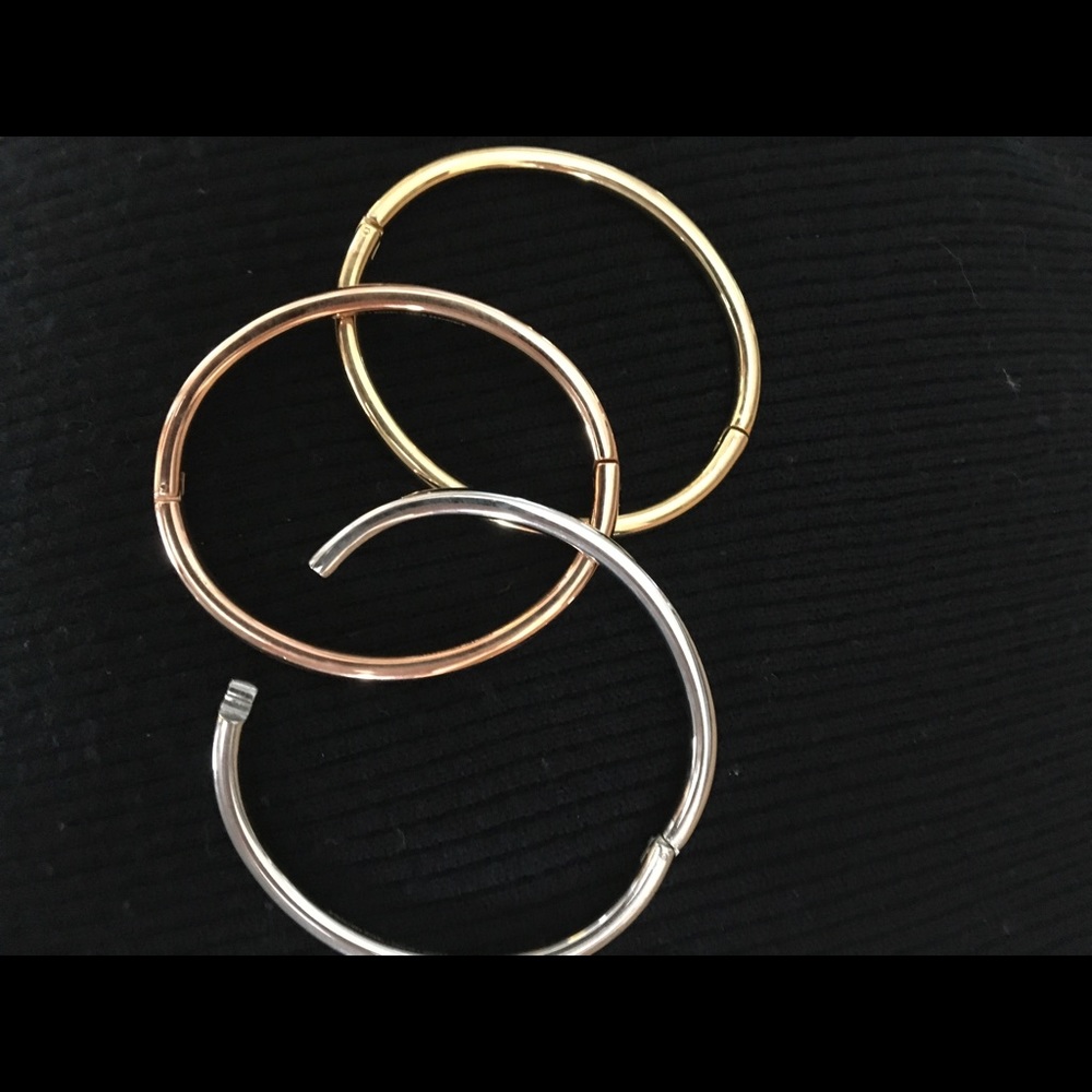 3 Stainless bracelets.
